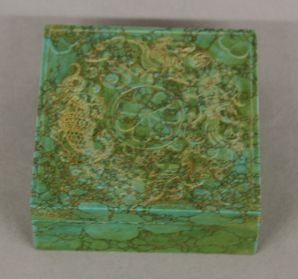 Carved Turquoise Box: Carved turquosie box, China, square shape, decorated with a flower surrounded by incised animals on cover. 1 1/4" X 3 1/2" X 3 1/2"