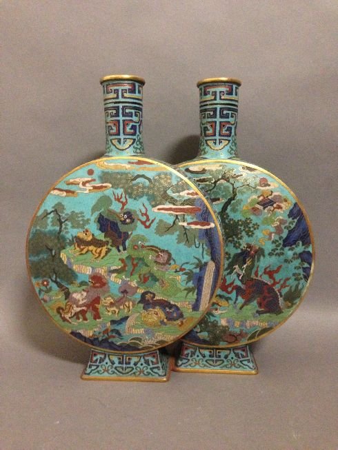 Qing Qianlong Chinese Cloisonne Vase: of bottle form, having multiple five-claw dragons writhing with fierce expressions on a ground of crashing waves with flaming pearls, having incised six-character Qianlong mark to the underside. 15.5"