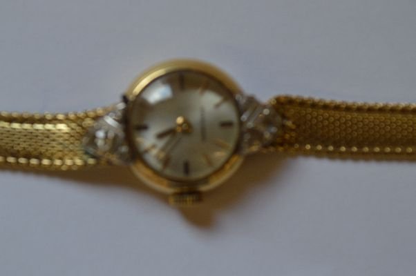 14K GOLD AND DIAMOND ULYSSE NARDIN LADIES WRIST WATCH: 14K GOLD AND DIAMOND ULYSSE NARDIN LADIES WRIST WATCH