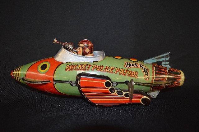 BUCK ROGERS SPACESHIP RARE TIN LITHOGRAPH TOY SET: BUCK ROGERS SPACESHIP RARE TIN LITHOGRAPH TOY SET. WORKING CONDITION. SOME SCUFFS TO FINISH AND OVERALL WEAR CONSISTENT WITH AGE.
