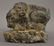 ANCIENT FRAGMENTED STONE CARVING OF A TIGER ATTACKING A