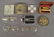 3 PAIRS OF GOLD RIMMED SPECTACLES, COMPACTS, AND