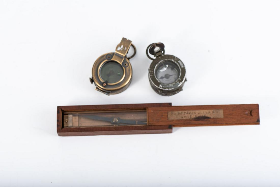 WWI/II MILITARY COMPASS, three in the lot: WWI/II MILITARY COMPASS, three in the lot WWI British and American issue, and a WWI Trough Compass by Rice and Diethelm Ltd. Compass is in original wooden box. When box lid is closed, a protruding pin