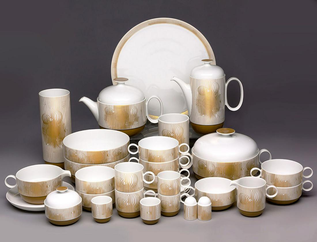 A ROSENTHAL STUDIO-LINE VASARELY POZZI 'MANIPUR DUO': White and brown with gold abstract pattern, comprising: 13 dinner plates, 12 soup coupes and 16 saucers, 9 side plates, 9 dessert bowls, a soup tureen and cover, 4 serving bowls, in sizes, 3 platters,