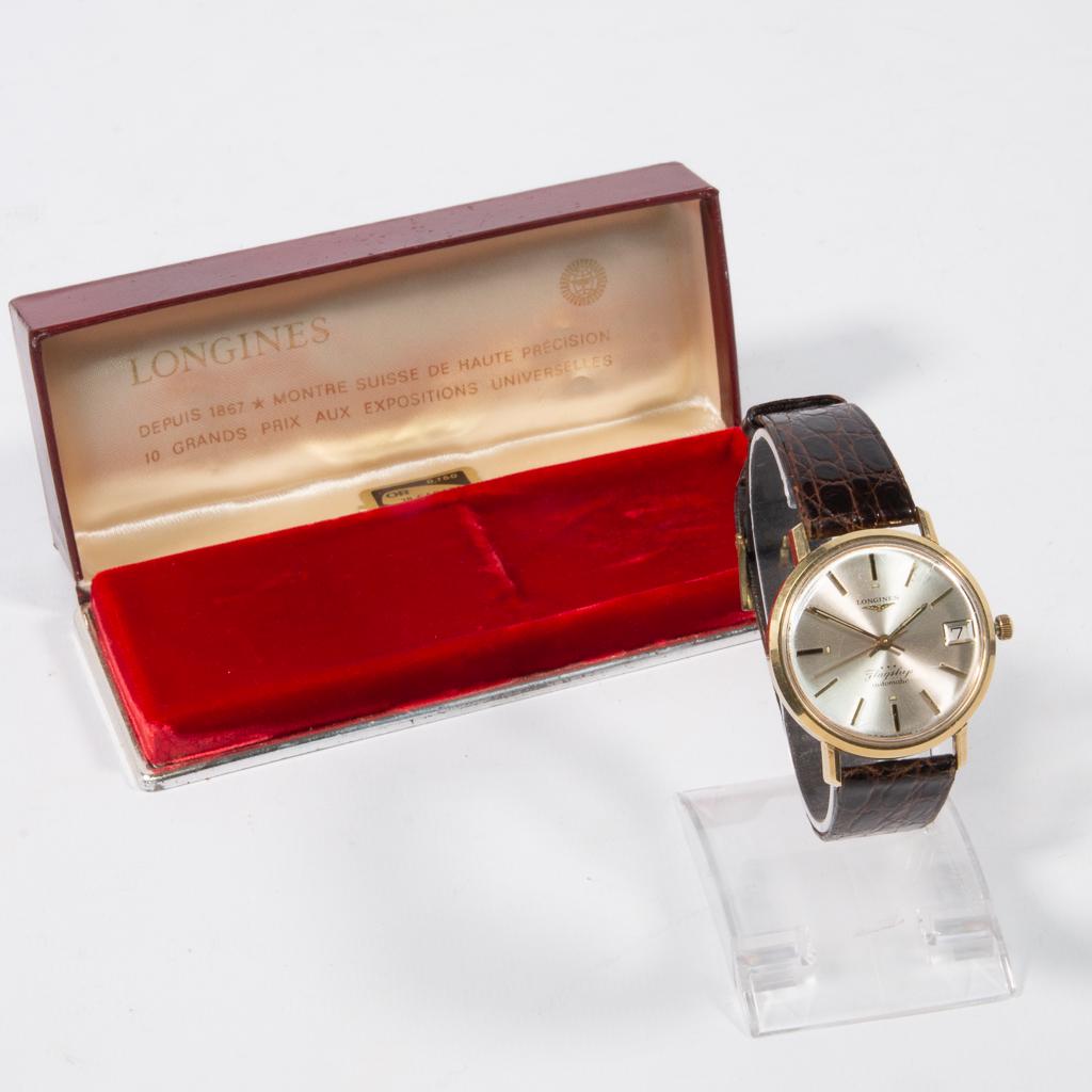 Longines Flagship, men's wristwatch, gold plated: Longines Flagship, gold plated automatic wristwatch with waterproof case. Mounted on a leather bracelet, accrylic crystal, with original box. Good cosmetic condition, working. 35 mm. Diameter (cm): 3.