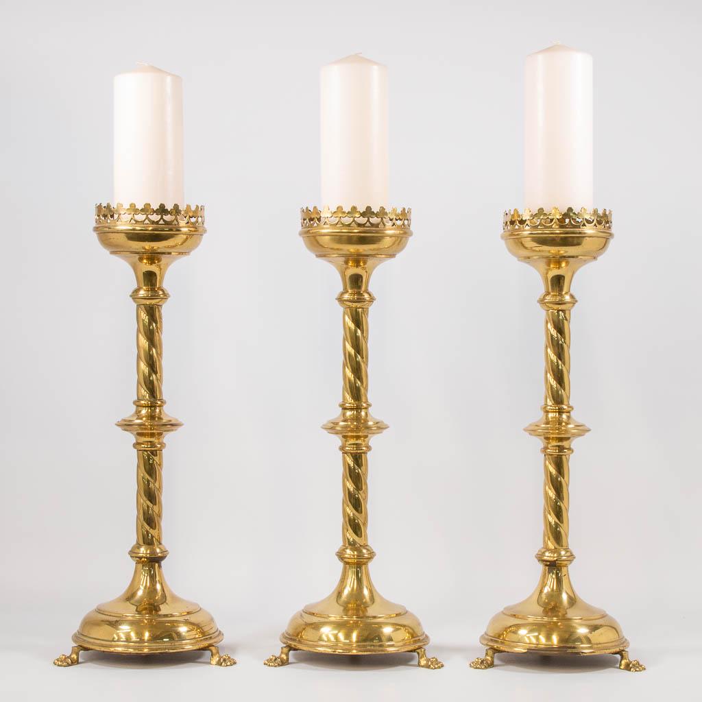 A collection of 3 church candlesticks, made of bronze. (1 of 9)
