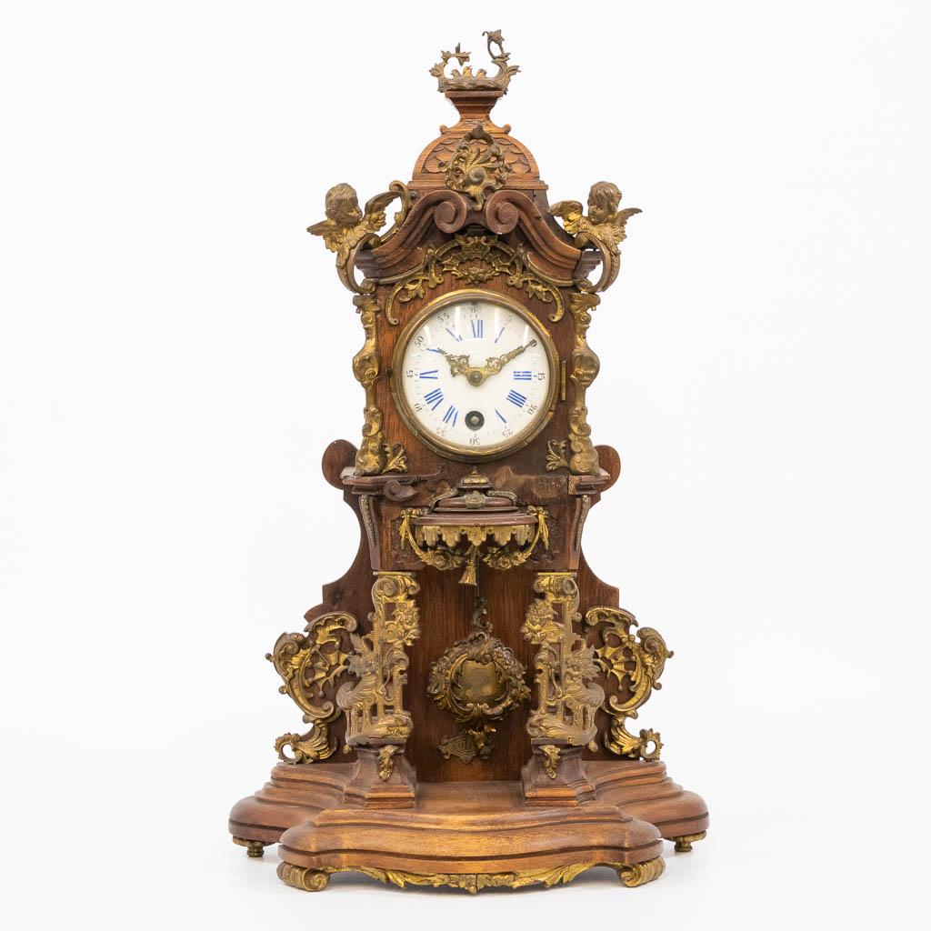 A German black forest table clock, marked Lenzkirch: A German black forest table clock with bronze decorations, marked 'Lenzkirch' and made between 1865 and 1870. (13 x 25 x 42 cm)