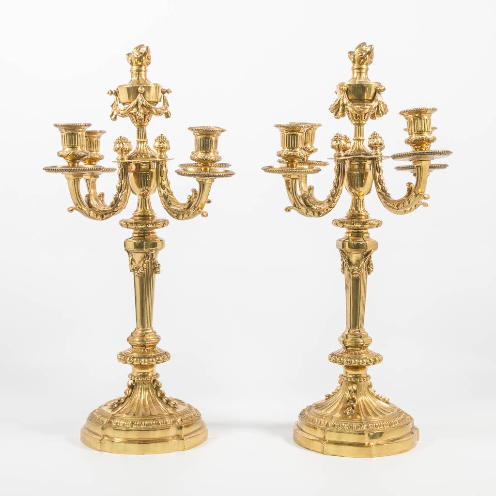 A pair of bronze candelabra in Louis XVI style, marked: A pair of bronze candelabra in Louis XVI style, marked H. Luppens en Cie, Bruxelles Bronzes dart. (30 x 30 x 50 cm)