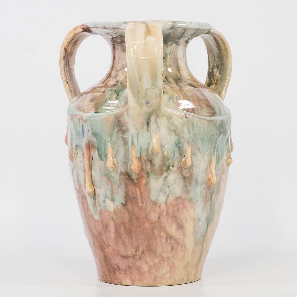 A vase made of Flemish Earthenware and made in the: A vase made of Flemish Earthenware and made in the workshop of Ceramaes in Ghent. Marked Ganda. (28,5 x 20 cm)
