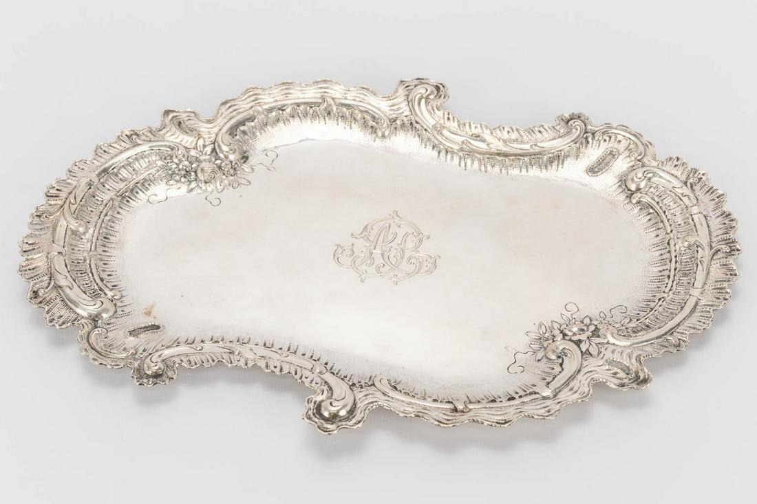 A silver serving tray with rich decorations, and (1 of 16)