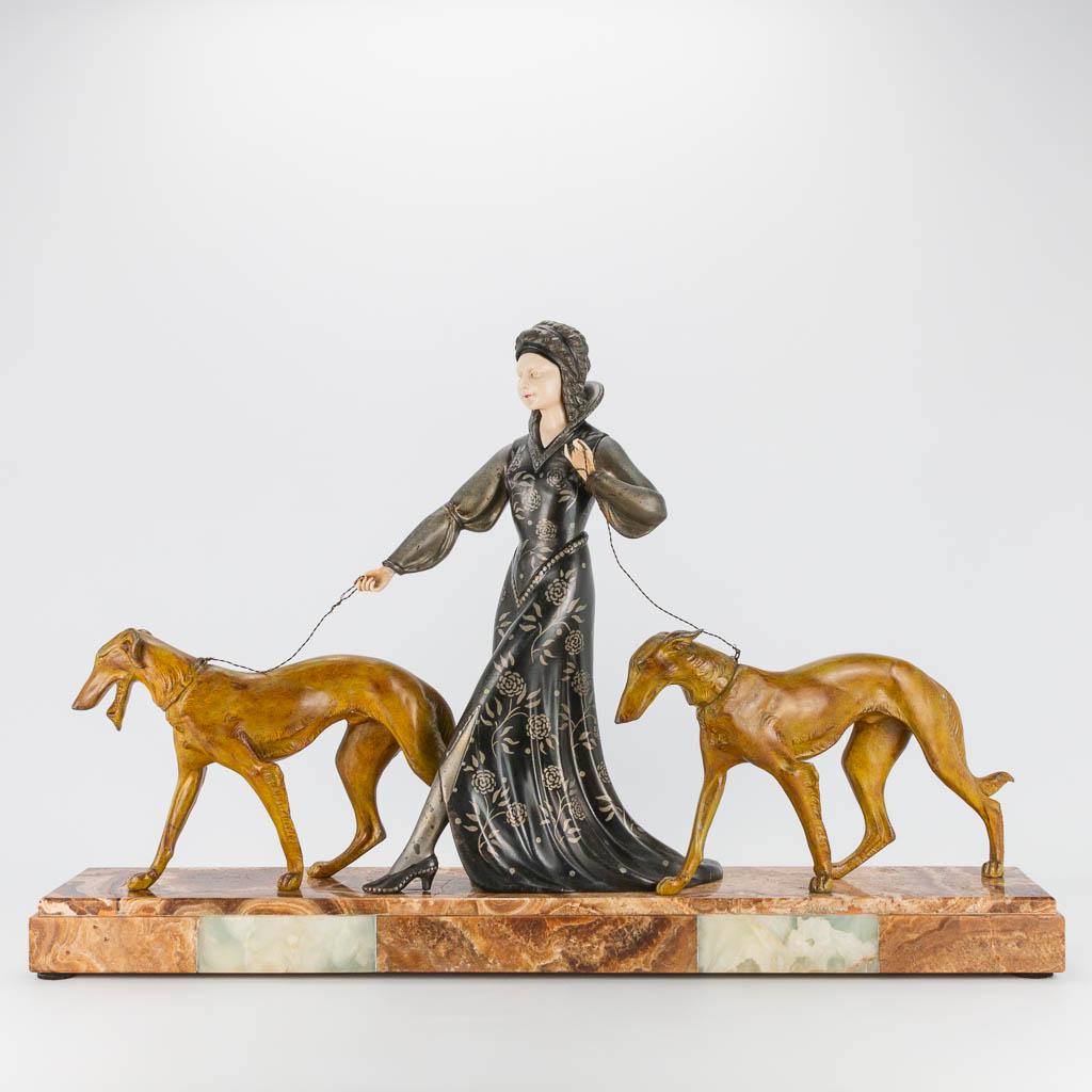 An art deco group of a lady walking her two greyhounds, (1 of 16)
