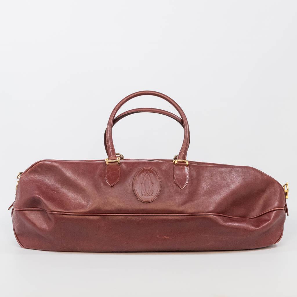 A leather Must De Cartier travel bag made of leather (1 of 18)