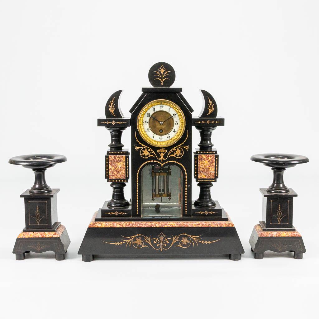 A 3 piece garniture clock made of black marble with (1 of 15)