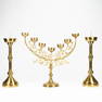 An assembled collection of neogotic candlesticks and a