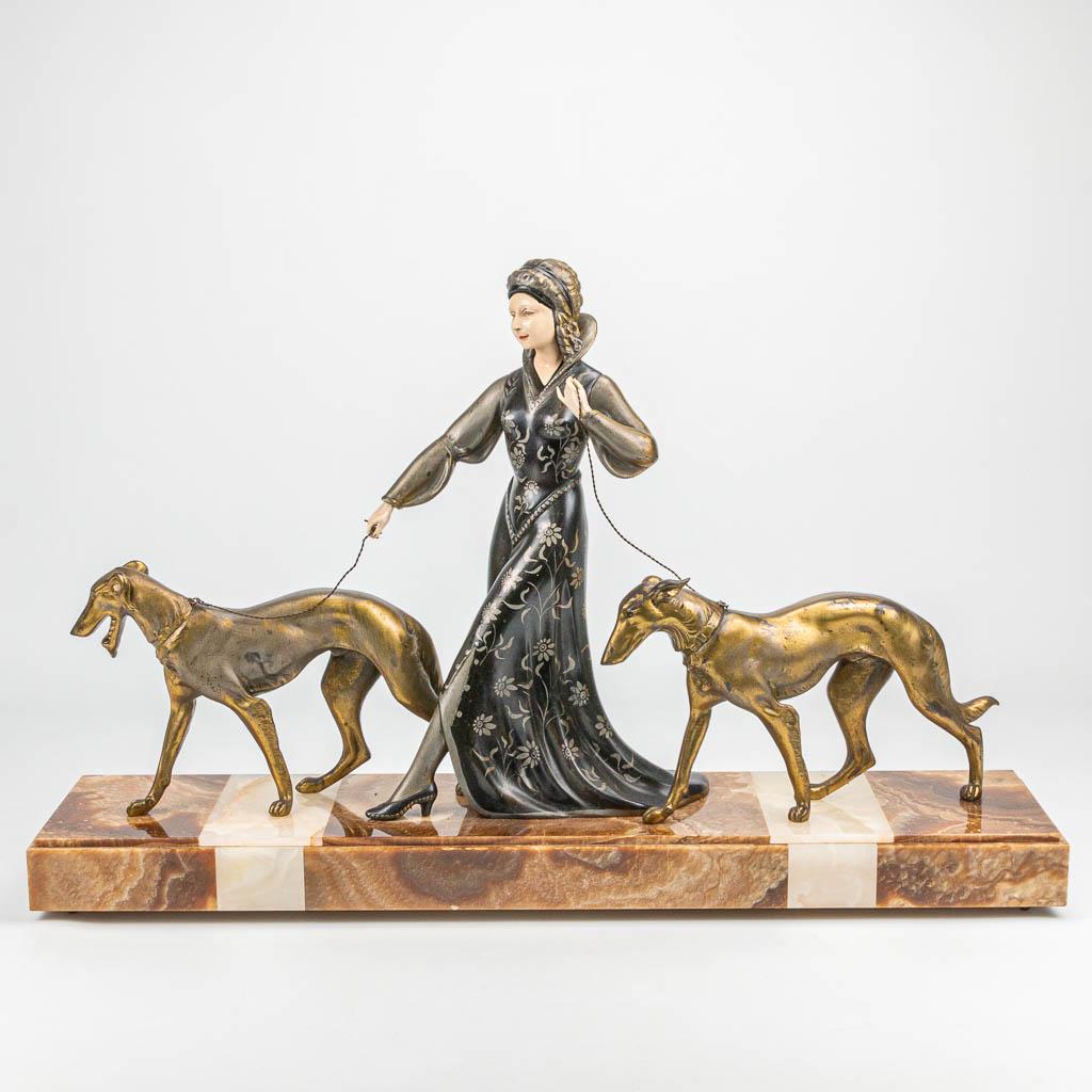 An art deco group of a lady walking her two dogs, (1 of 8)
