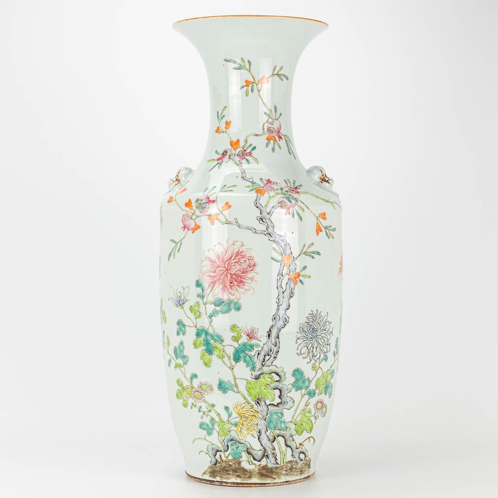 A vase made of Chinese porcelain and decorated with: A vase made of Chinese porcelain and decorated with roses and bats. 19th century. (58 x 23 cm)
