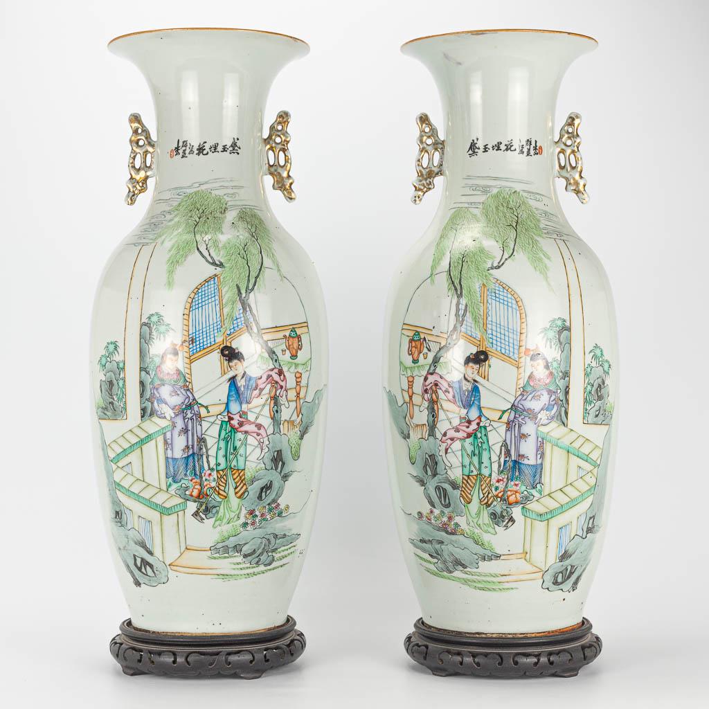 A pair of vases made of Chinese porcelain and decorated: A pair of vases made of Chinese porcelain and decorated with ladies working in the garden, calligraphy. 19th/20th century. (59 x 23 cm)