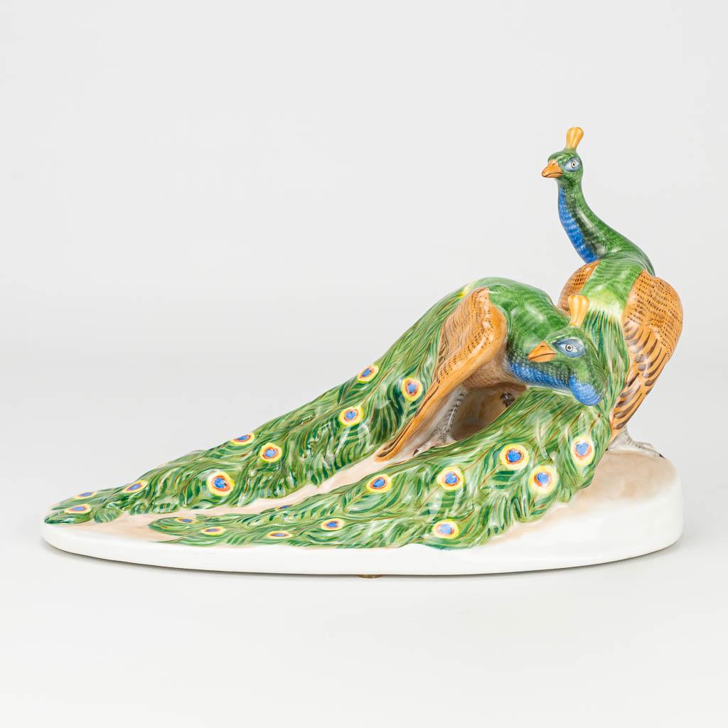 A figurine of peacocks with hand-painted decor and: A figurine of peacocks with hand-painted decor and marked Herend, Hungary. Model 5114-0-00/C. (11 x 21 x 12 cm)