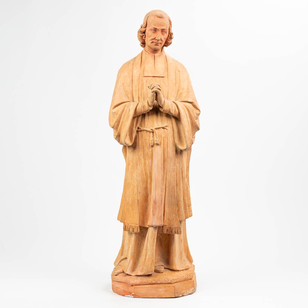 A large statue of a holy figurine of Jean-Marie Vianney (1 of 11)