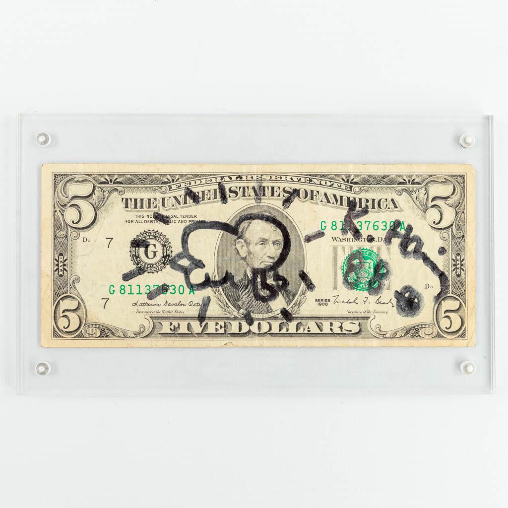 Keith HARING (1958-1990) Signed Five dollar bill: Keith HARING (1958-1990) A signed $5 bill featuring Haring?s Radiant Baby-drawing, his signature and a portrait of the 16th President of the United States of America - Abraham Lincoln. The $5 bill is