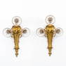 A pair of sconces made of gilt bronze in a Louis XVI