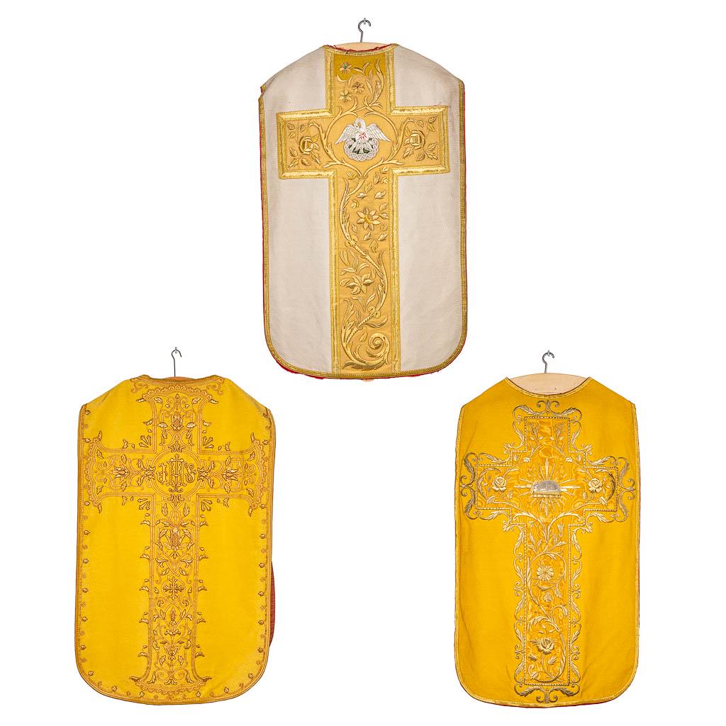 A collection of 3 Roman Chasubles, decorated with embroidered floral images in thick gold thread. (1 of 20)