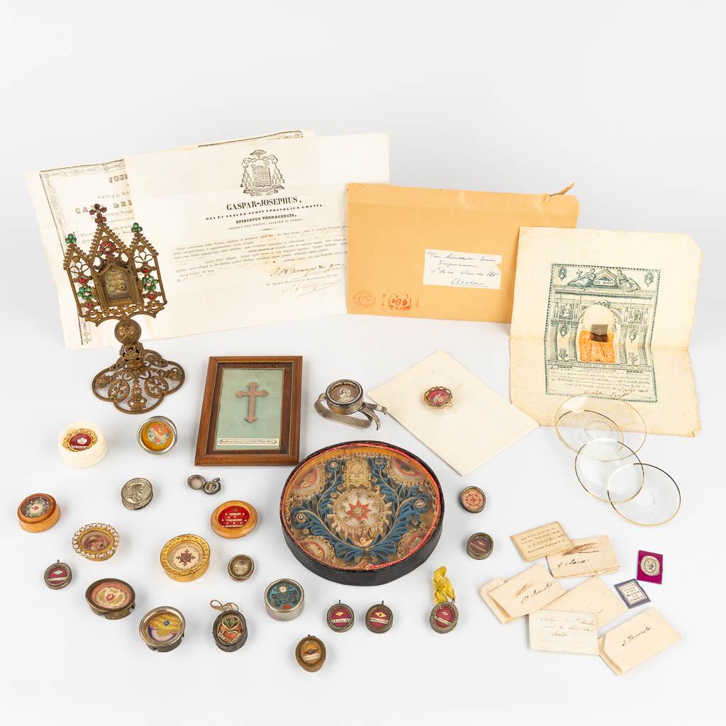 A small and assembled collection of relics, and reliquary items. (L:10 x W:10 x H:24 cm) (1 of 19)