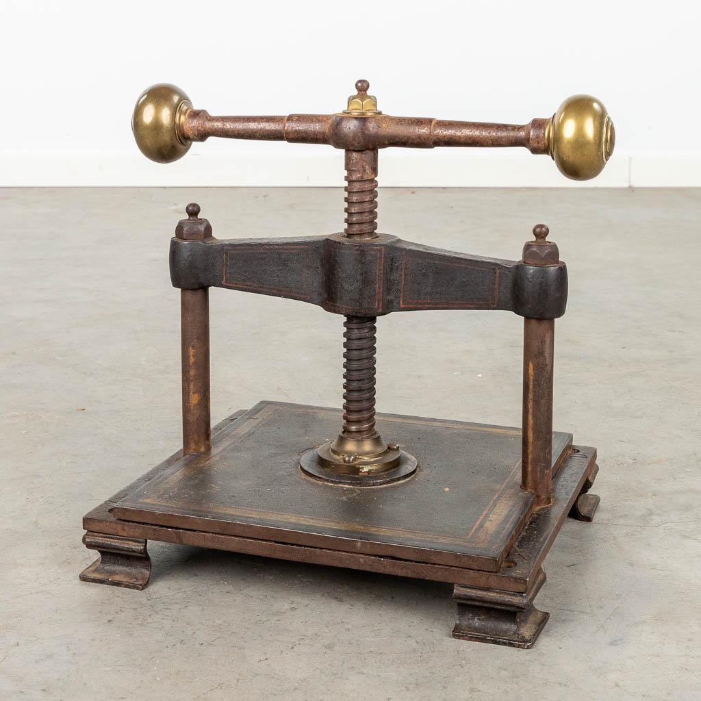 An antique book press, made of metal.  (L:30 x W:38 x H:36 cm) (1 of 11)