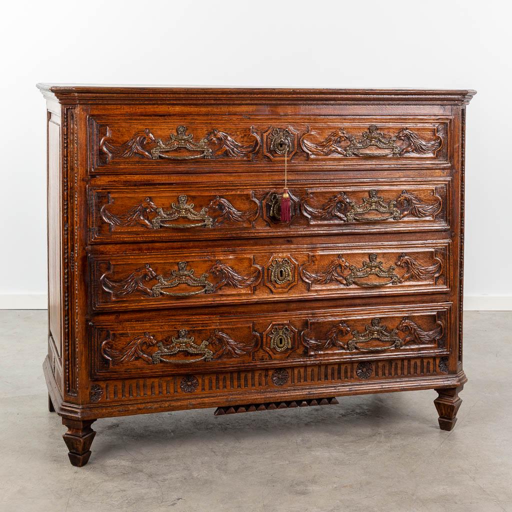 An antique commode with 4 drawers, decorated with mythological figurines and mounted with bronze. (1 of 13)
