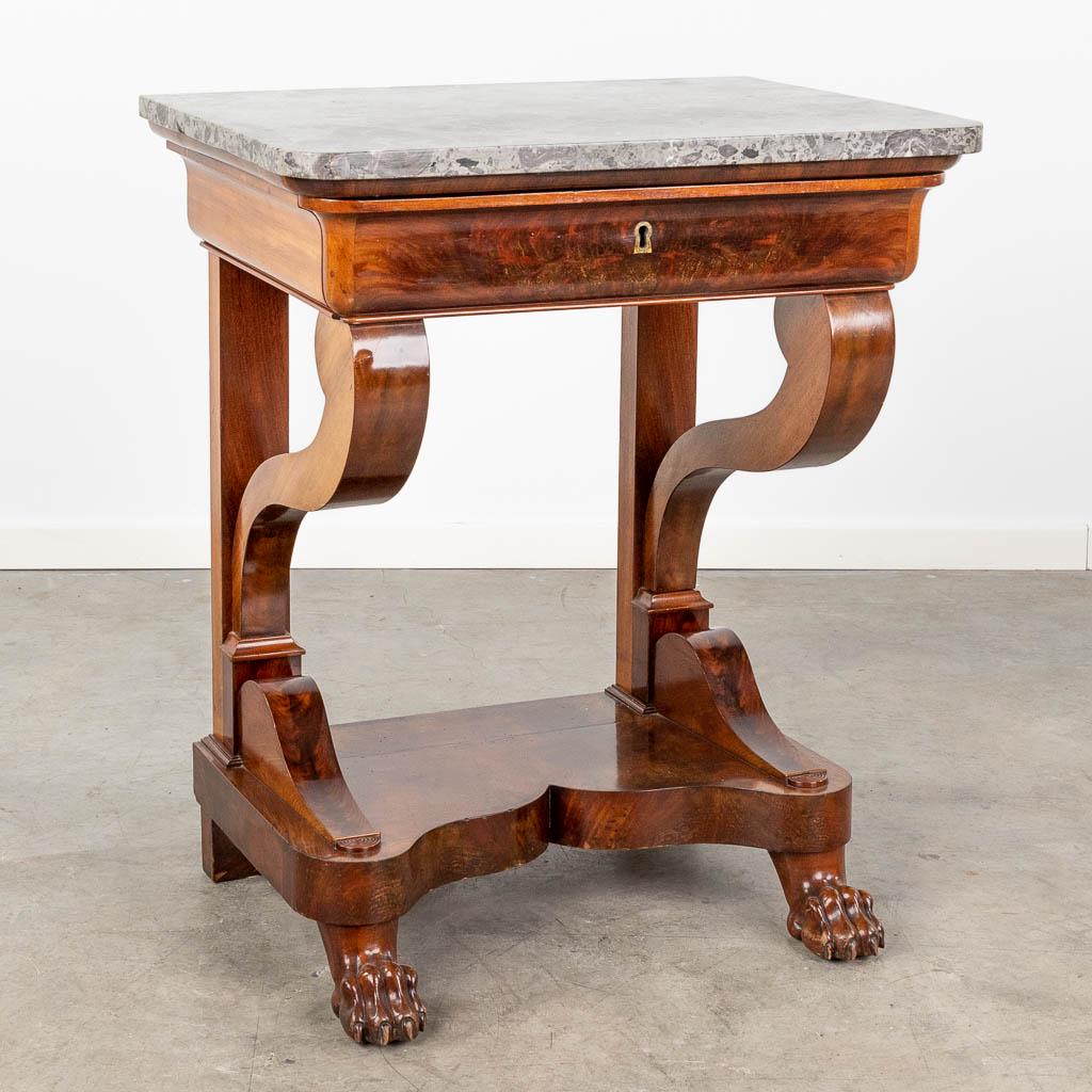 A small console table with a marble top, Directoire style. 19th C. (L:48 x W:69 x H:82 cm): A small console table with a marble top, made of mahogany veneer and claw feet in Directoire style. 19th century. (L:48 x W:69 x H:82 cm)
