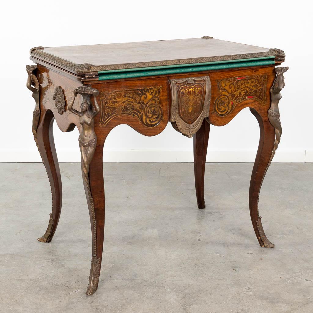A game table inlaid in the style of boulle/Napoleon 3 mounted with bronze. Circa 1970.  (L:52 x W:80 (1 of 15)
