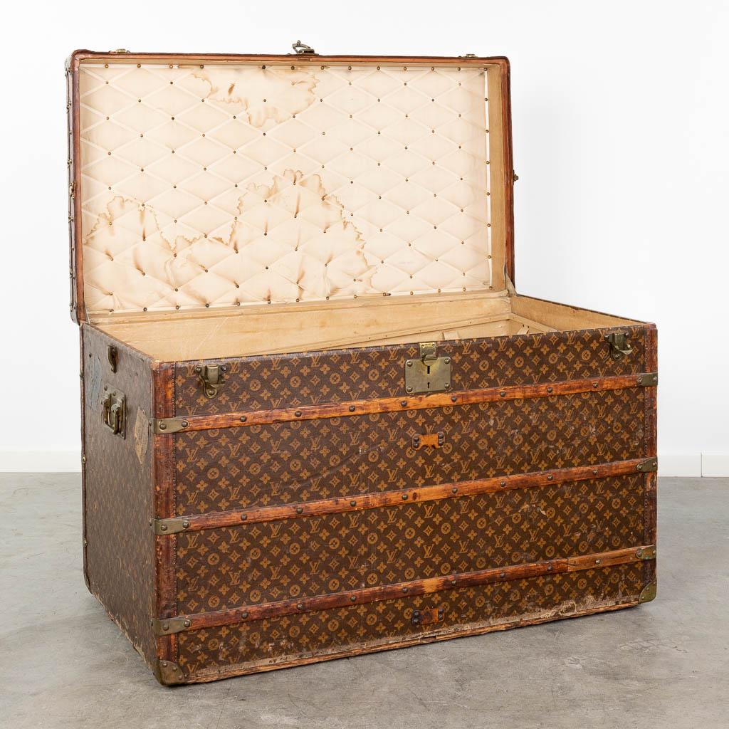 Louis Vuitton, a large and antique suitcase.  (L:63 x W:113 x H:72 cm) (1 of 20)