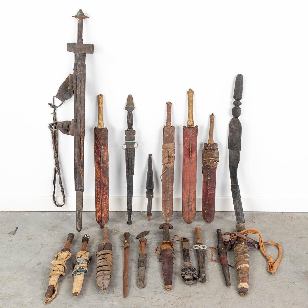 A large collection of swords and daggers of African origin. (H: 86 cm): A large collection of swords and daggers of African origin. (H: 86 cm)