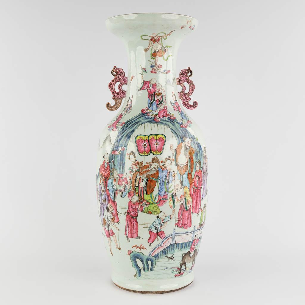 A Chinese Famille Rose vase, decorated with Wise men and items of good fortune. 19th C. (H:60 x D:25 (1 of 18)