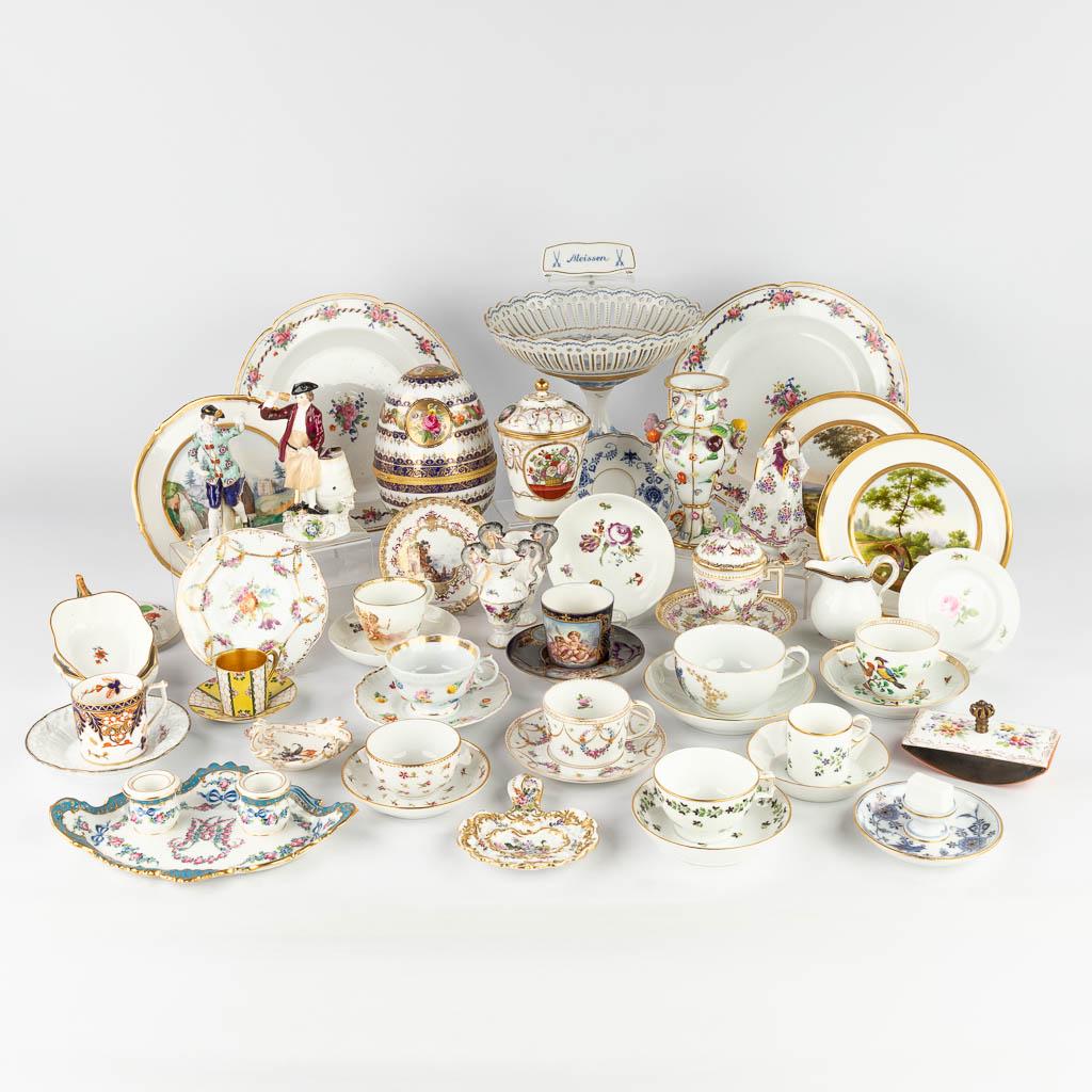 A large collection of porcelain items and table accessories of multiple marks. 19th and 20th C.: A large collection of porcelain items and table accessories of multiple marks. 19th and 20th century. Volkstedt, Royal Vienna, Meissen, Sèvres, Limoges, KPM, Dresden, .. (H:25 cm)