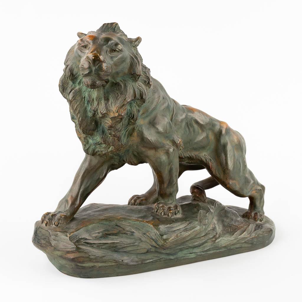 Armand FAGOTTO (XIX-XX) 'Lion' patinated terracotta. (D:20 x W:47 x H:39 cm): Armand FAGOTTO (XIX-XX) 'Lion' patinated terracotta. Signed A.Fagotto Marked 'Made in Belgium' Dimensions: (D:20 x W:47 x H:39 cm)