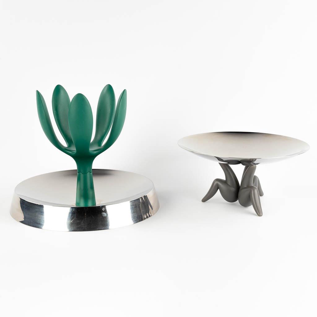 Alessi, two fruit bowls, acrylic and inox. (H:27 x D:31 cm): Alessi, two fruit bowls, acrylic and inox. Philippe STARCK (1949) 'Les Ministres'Stefano GIOVANNONI (1954) 'Fruit Mama' Dimensions:(H:27 x D:31 cm)