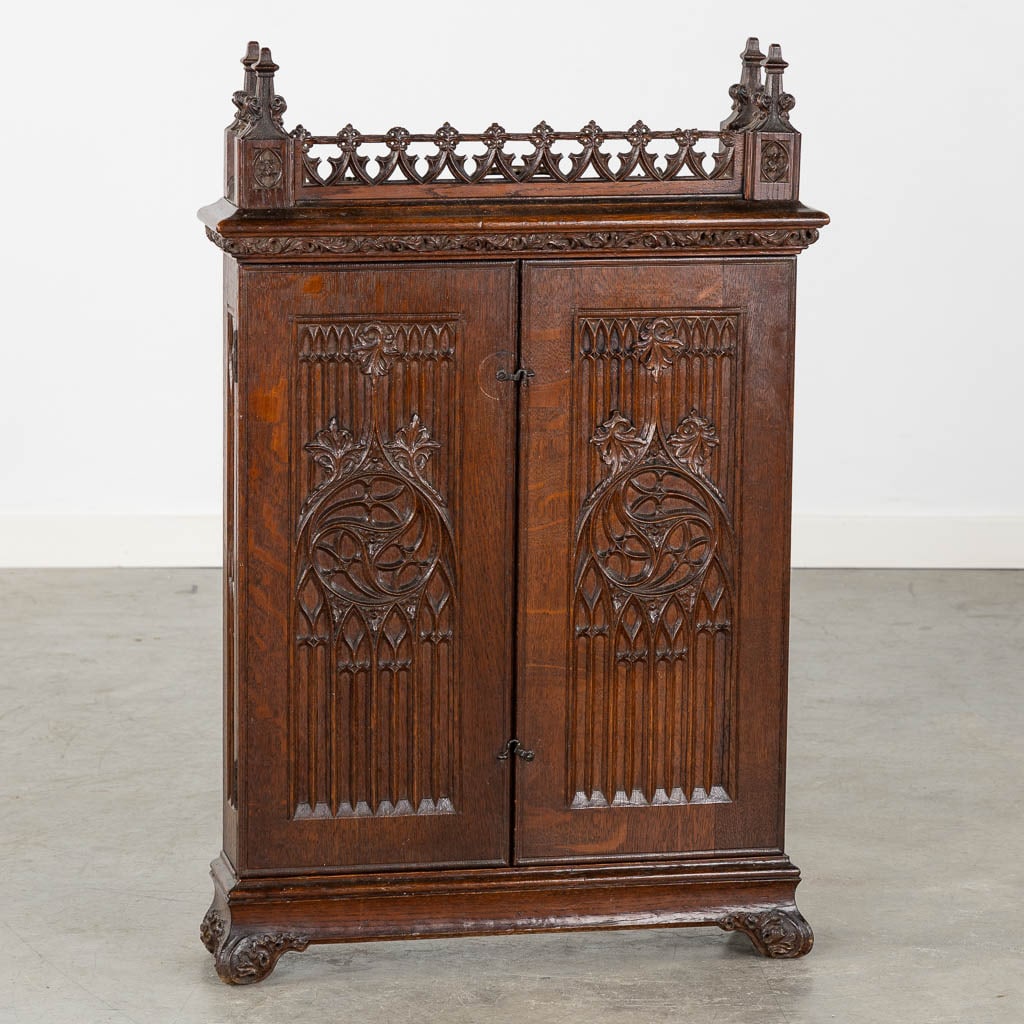 An antique wall-mounted cabinet, wood-sculptures in Gothic Revival style. 19th C. (L:14 x W:54 x (1 of 14)