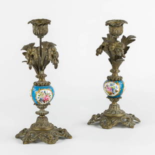 A pair of candlesticks, bronze decorated with sèvres porcelain. (H:22 x D:11,5 cm): A pair of candlesticks, bronze decorated with sèvres porcelain. Dimensions: (H:22 x D:11,5 cm)