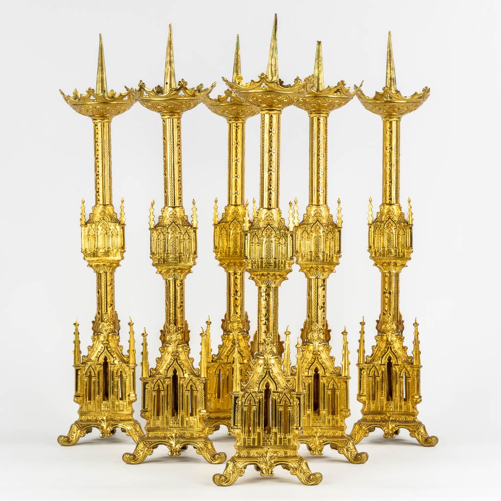 Six church candlesticks, gilt brass in a Gothic Revival style. (W:16,5 x H:70 cm) (1 of 12)
