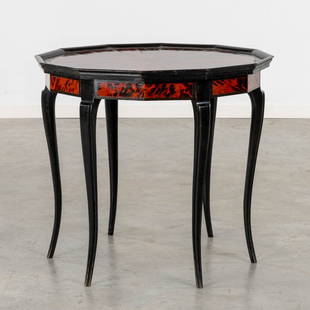 Maison Franck, Antwerp, an octagonal side table, tortoise shell and ebonised wood. (H:65 x D:72 cm): Maison Franck, Antwerp, an octagonal side table, tortoise shell and ebonised wood and a glass top. Dimensions: (H:65 x D:72 cm)