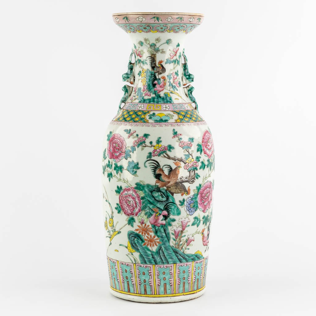 A large Chinese Famille Rose vase decorated with Chicken and Flora. (H:59 x D:23 cm): A large Chinese Famille Rose vase decorated with Chicken and Flora. Condition report: - The bottom of the vase is overpainted. Otherwise in good condition. Dimensions: (H:59 x D:23 cm)