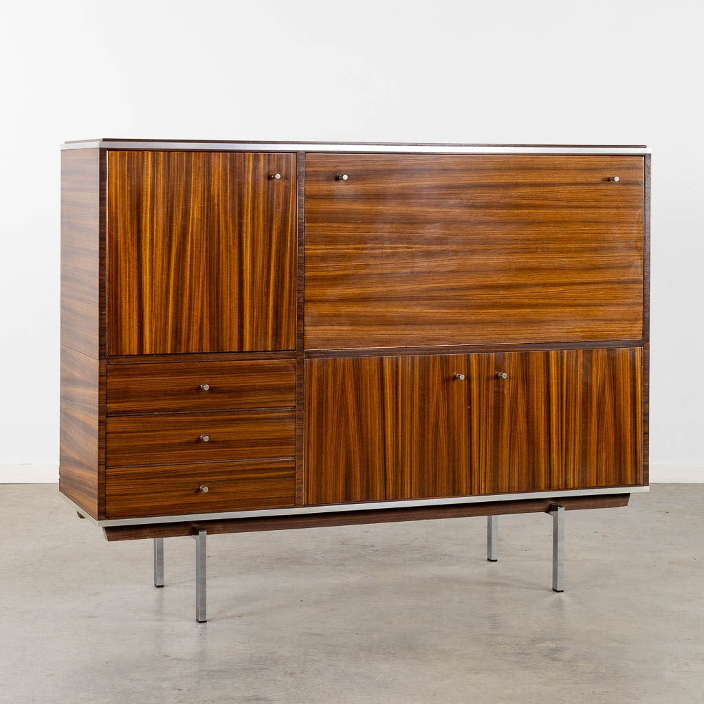 Pieter DE BRUYNE (1931-1987) 'Highboard & Bar Cabinet'. (L:47 x W:153 x H:120 cm): Pieter DE BRUYNE (1931-1987) 'Highboard & Bar Cabinet'. Rosewood veneerChromed metal hardware. Dimensions: (L:47 x W:153 x H:120 cm)