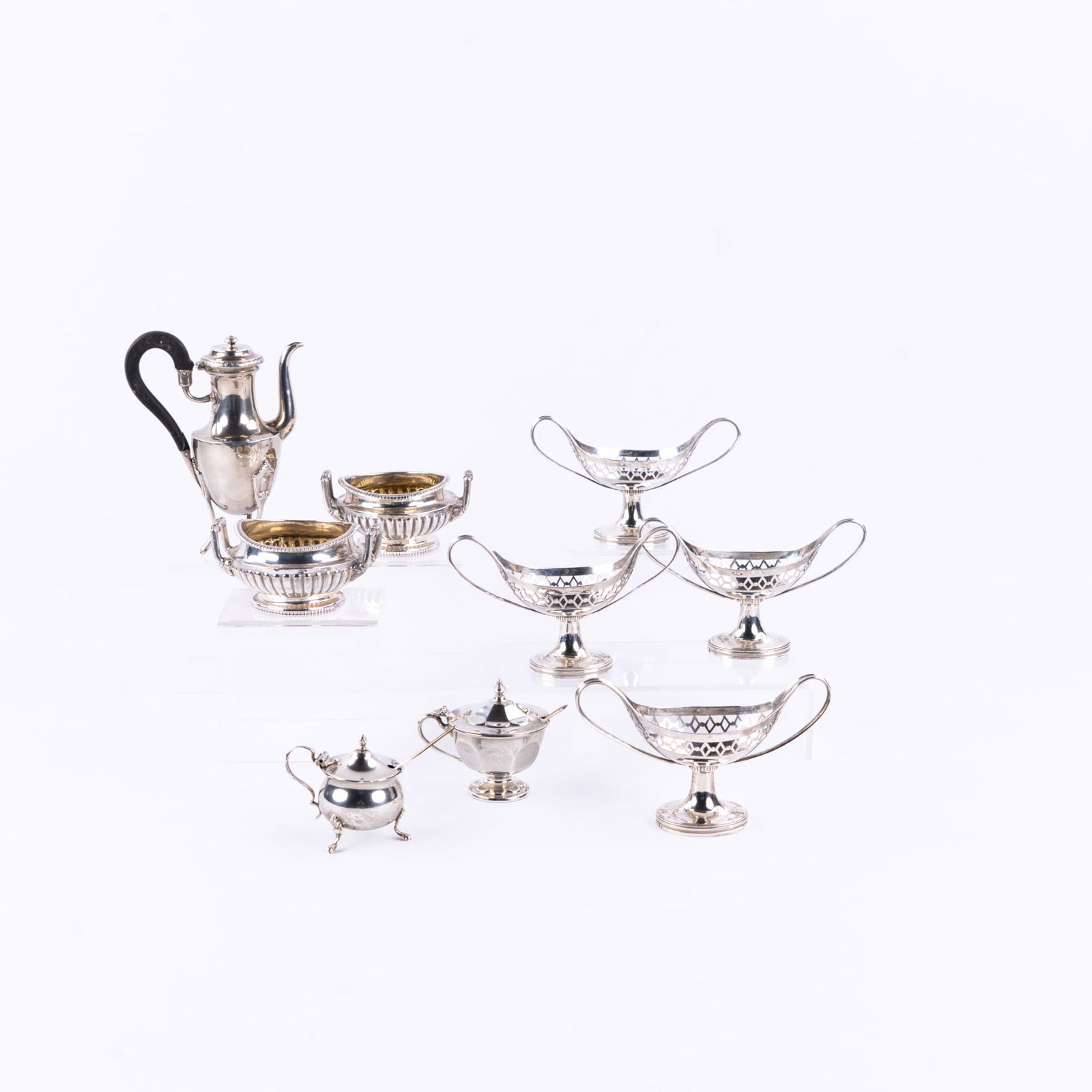 Nine pieces of solid silver table accessories, Silver. 998g.: Nine pieces of solid silver table accessories, Silver.¬†, Four boat-shaped salt and pepper jars:-¬†Grade mark 934/1000 (laurel branches with number 1, 1815-1832)- Warranty mark (fist with stick,