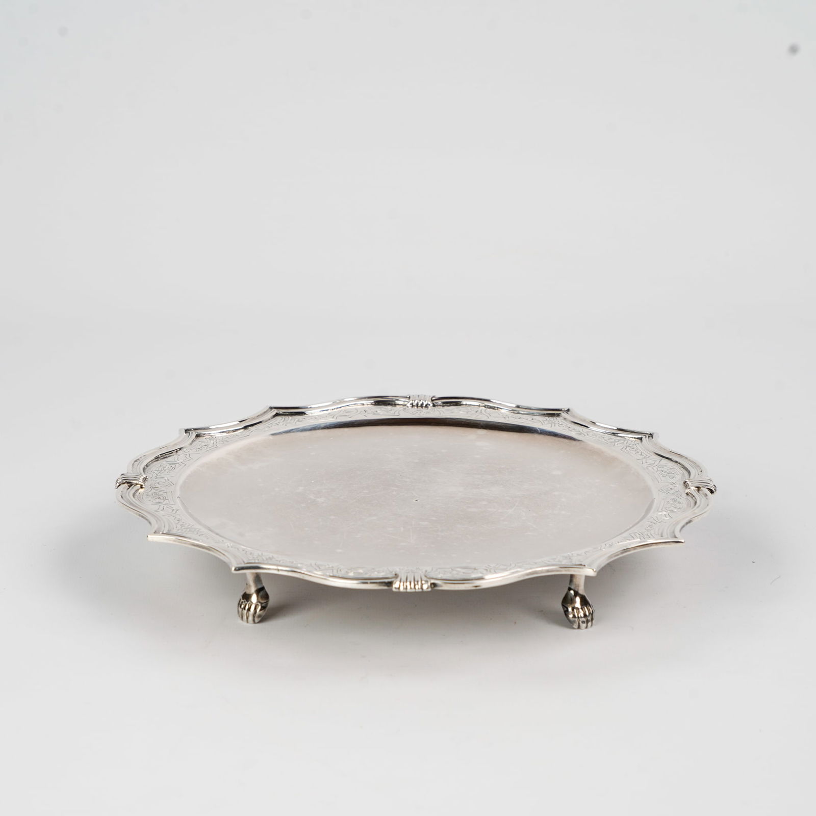 P. Josephus De Coene, Ypres, A silver Assiette Volante, 1751. Silver. 719g.: P. Josephus De Coene, Ypres, A silver Assiette Volante, 1751. Silver., Town marks for Ypres (Crowned Lorraine cross and¬† Lion on a shield)Date mark: 1751Makers mark: P. Josephus De Coene, Total gr