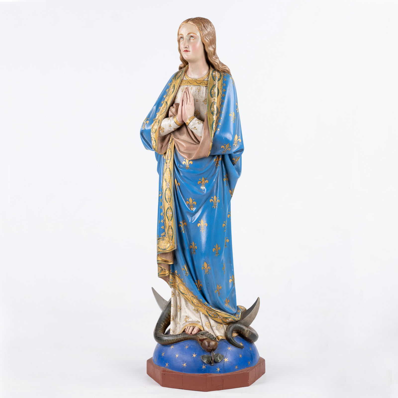 An antique figurine 'Madonna standing on the Crescent moon, trampling the serpent. Polychrome wood. (1 of 7)