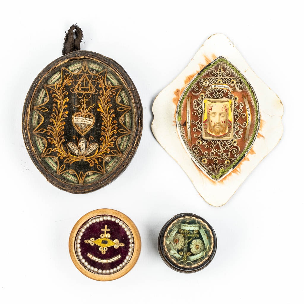 A collection of 4 reliquary frames with relics for Saints and Martyrs.: A collection of 4 reliquary frames with relics for Saints and Martyrs. Saints Francois, Saint Sanislas and Saint Claire. 'Pierre Du Jardin Des Olives', stone from Gethsemane's garden, added 17 a