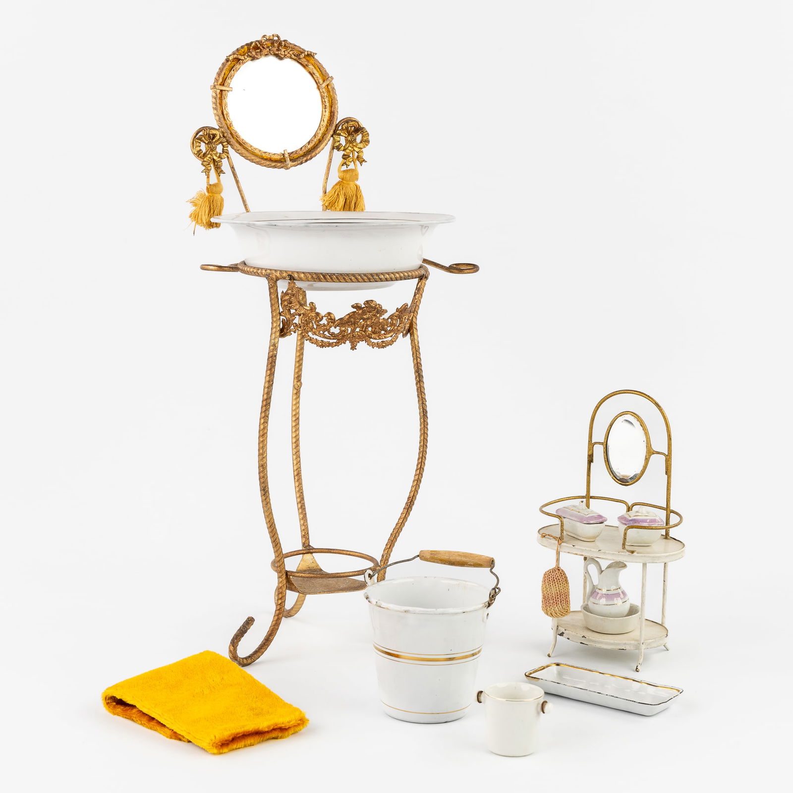 A Collection of Toy Dressing and Toilet Tables, Accessories in Porcelain and Enameled Metal. (1 of 5)