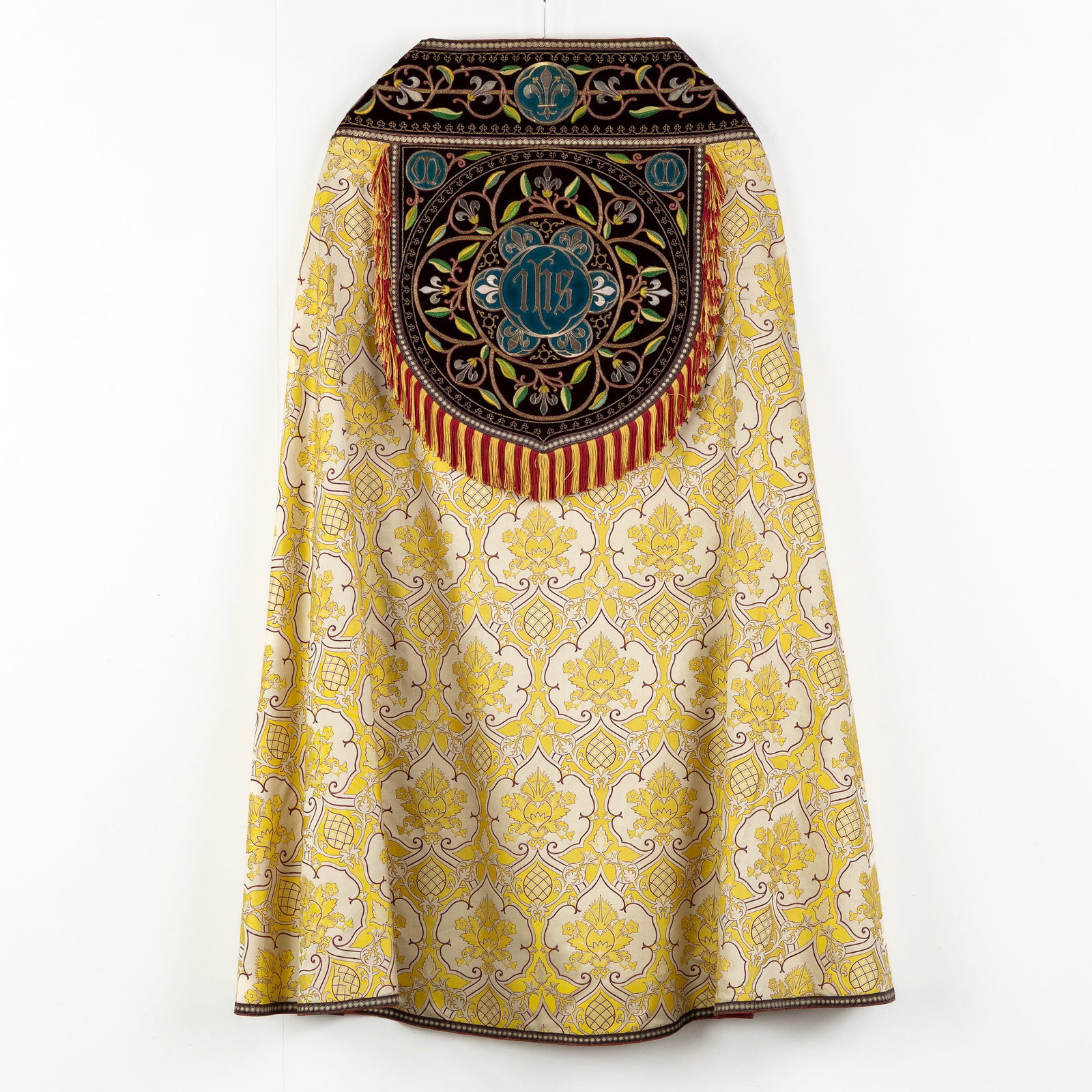 A Cope with thick Silverthreat Embroideries, decorated with Fleur-de-Lys and IHS logo: A Cope with thick Silverthreat Embroideries, decorated with Fleur-de-Lys and IHS logo