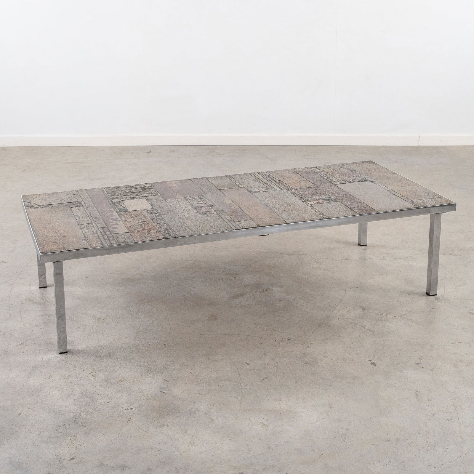 Pia Manu (Xx) 'Coffee Table'.: Pia Manu (XX) 'Coffee Table'. Chromed metal inlaid with ceramics. Signed Pia Manu. Dimensions:(W:150 x H:37 x L:66 cm)